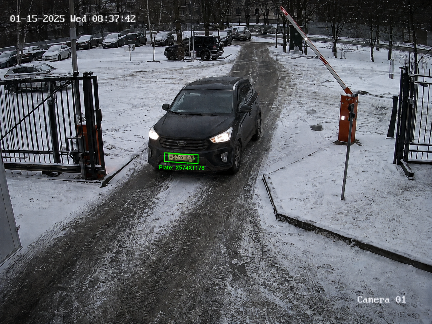 Vehicle entering a parking lot at night with headlight glare